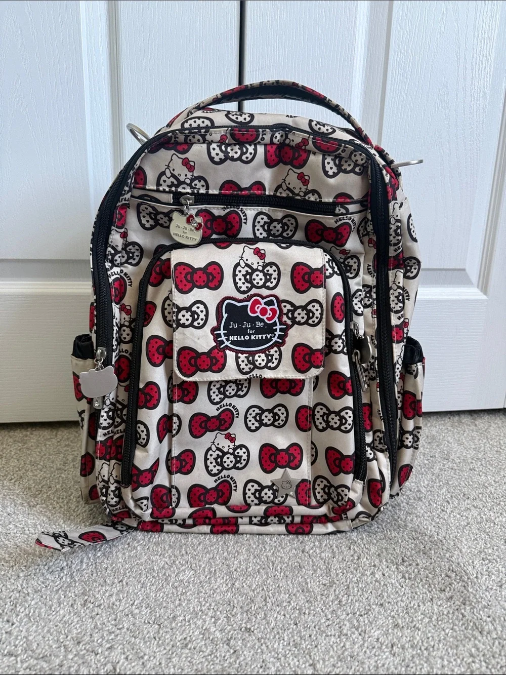 Ju-Ju-Be Hello Kitty Cream Backpack with Red & Black Bow Print